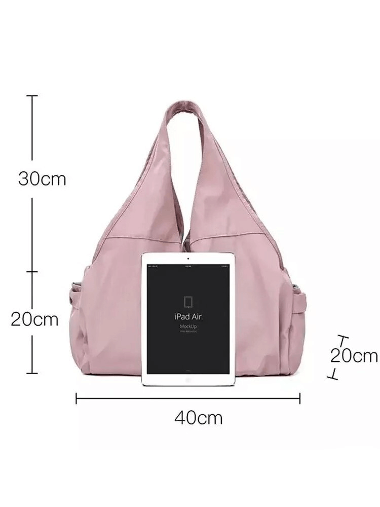 Waterproof pink women's sports bag with many pockets, shown with dimensions 40x30x20 cm and paired with an iPad Air for size reference.